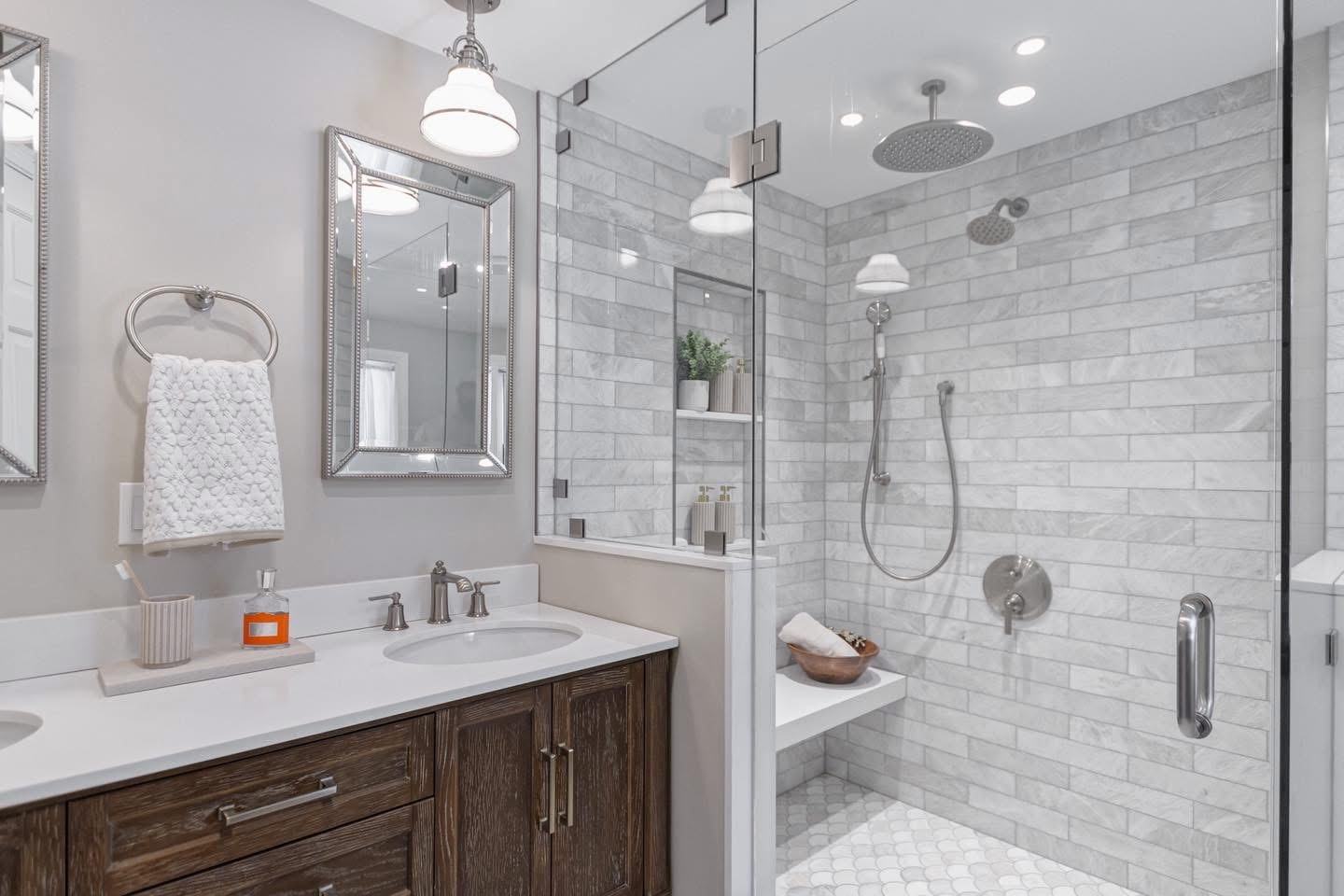 Finished bathroom remodel with marble subway tile and rain shower head, plumbing by Ferguson Plumbing Design